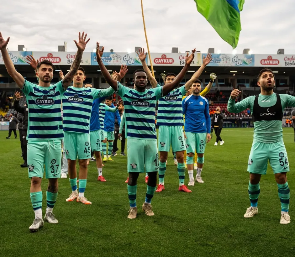 Ibrahim Olawoyin and teammates celebrates relegation escape