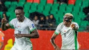 Chidera Ejuke and Wilfred Ndidi celebrate Sevilla star’s first goal for Nigeria in extra-time win over Gabon