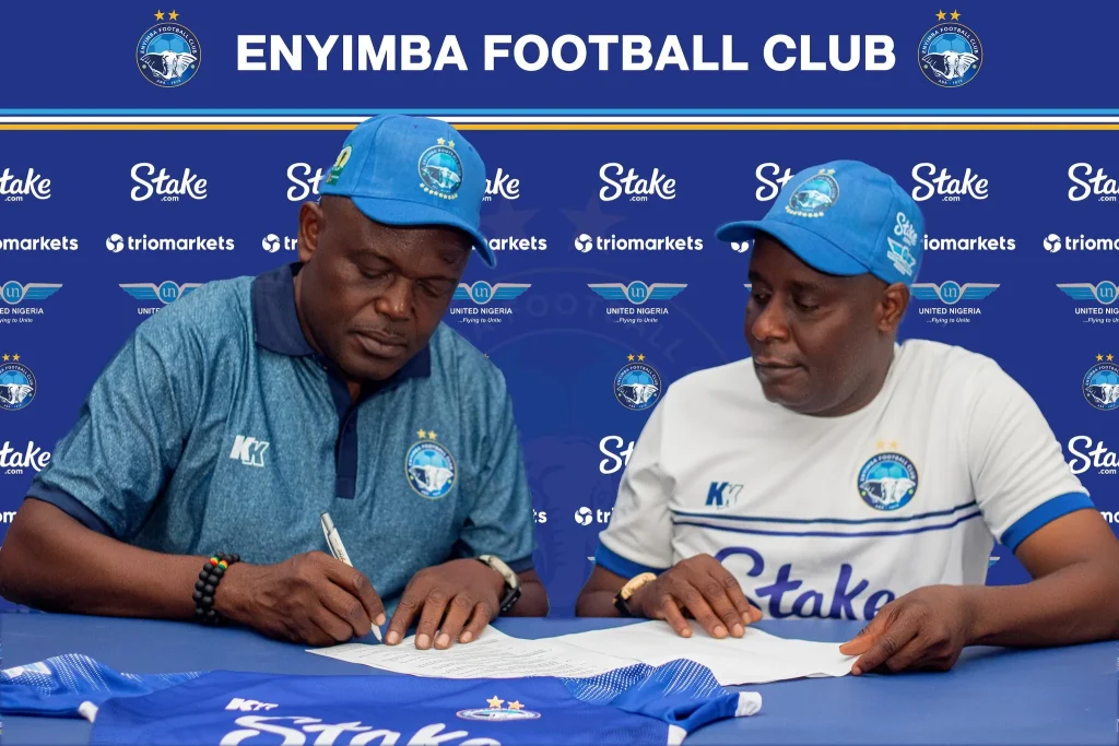 Stanley Eguma sigining for Enyimba