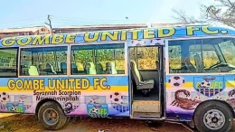 Gombe United players with newly branded bus