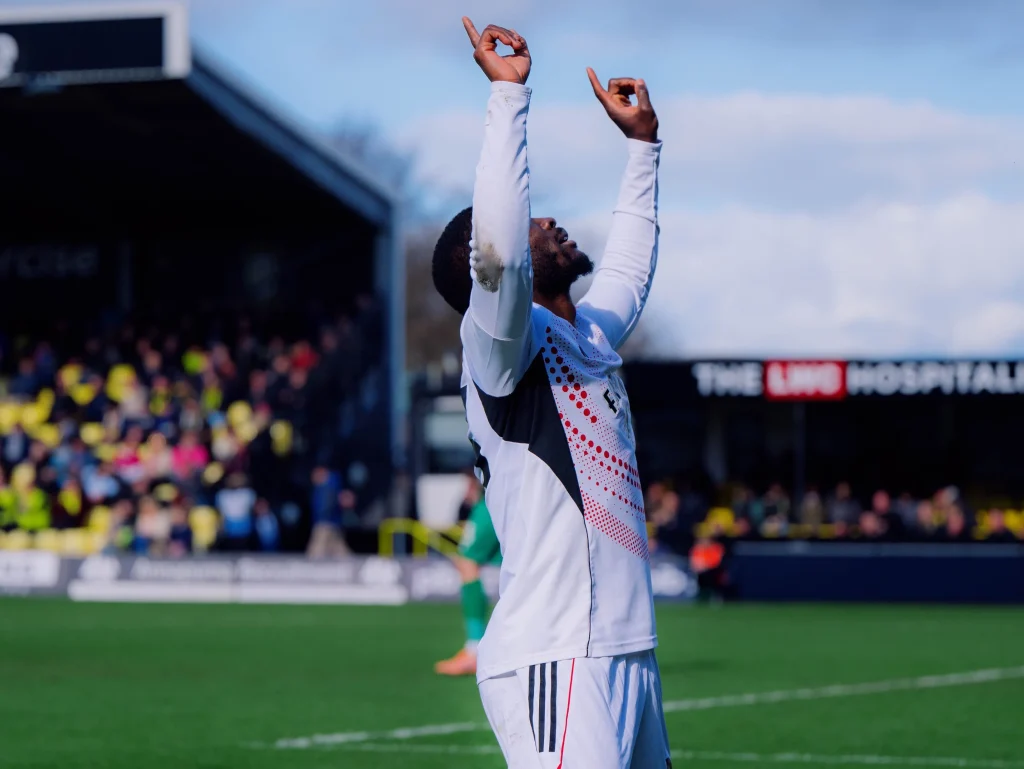 Daniel Udoh celebrating winning goal for Salford City