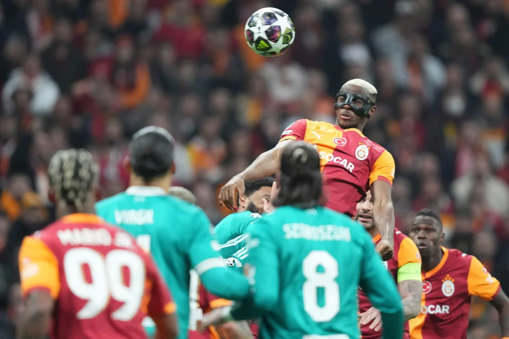 Victor Osimhen challenges Liverpool defenders in Champions League clash