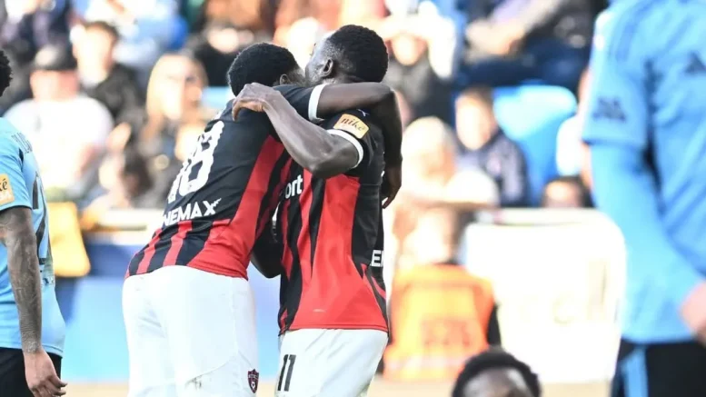 Hilary Gong and Philip Azango celebrate goal for Spartak Trnava